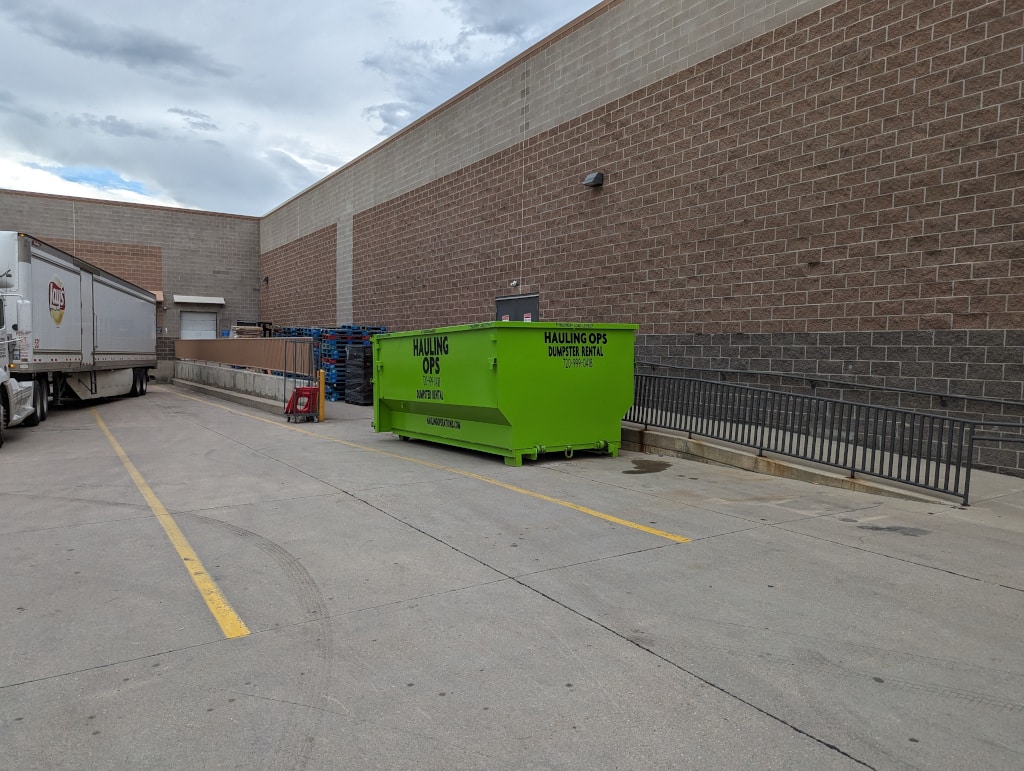 Hauling Ops - Dumpster in front of building